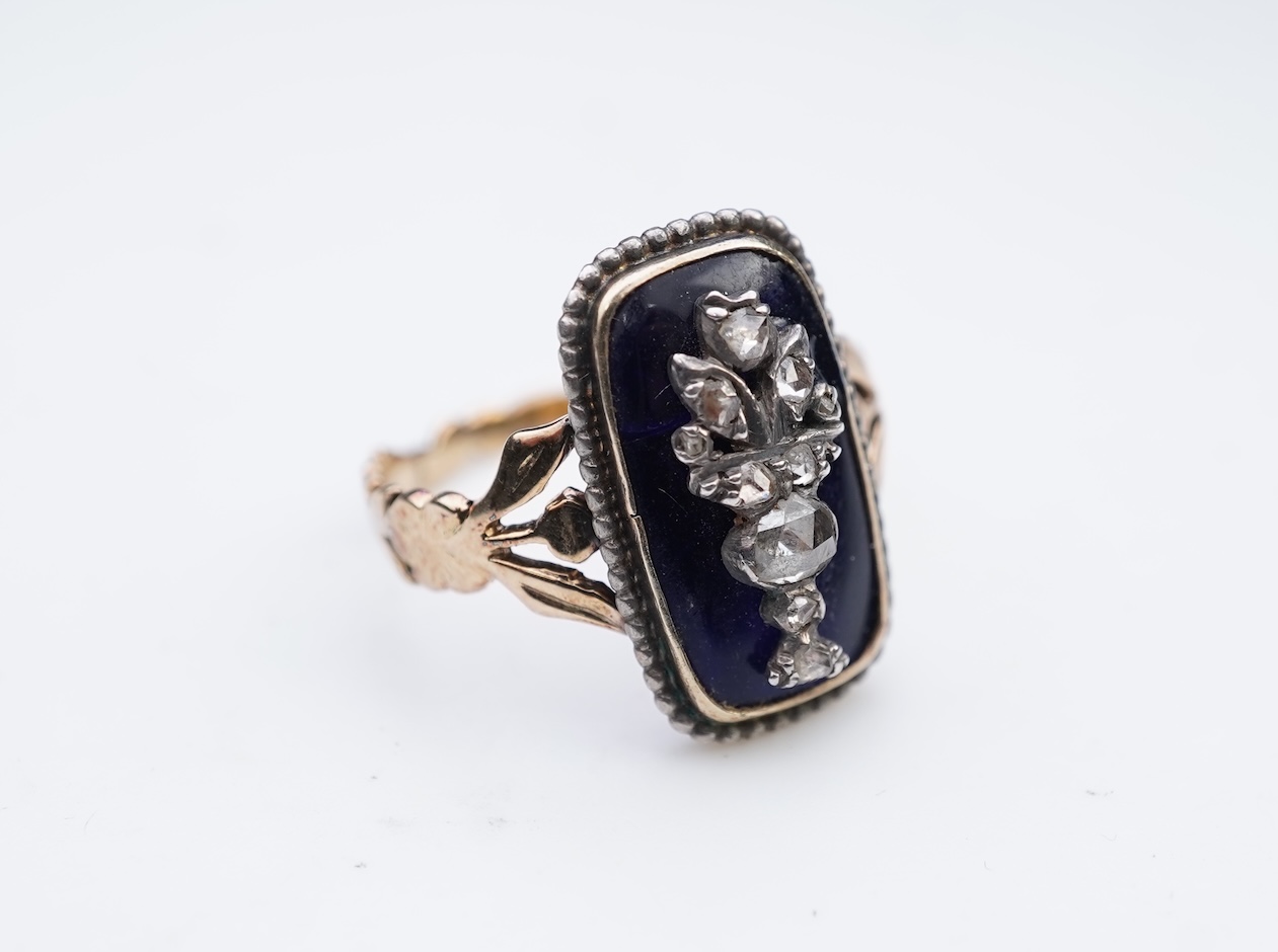 A diamond and blue glass ring